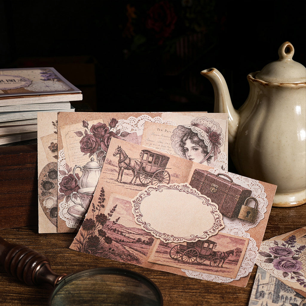 Pink-toned vintage papers with teapot and stationery props