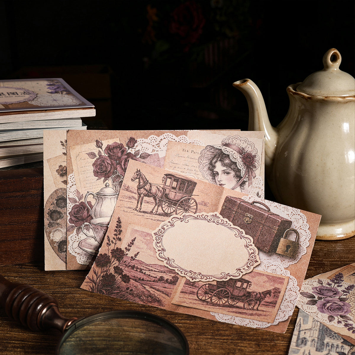 Pink-toned vintage papers with teapot and stationery props