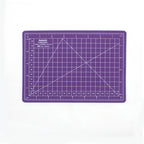 Purple A5 self-healing cutting mat with white measurement grid