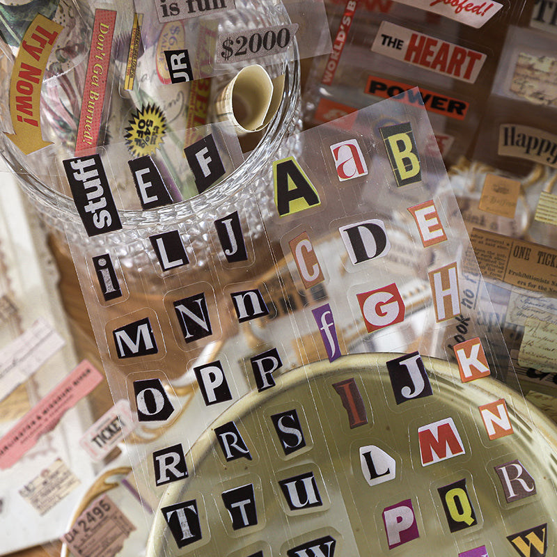 Clear PET tape with scattered magazine-cut alphabet letters in bold colors for junk journal headers and labels