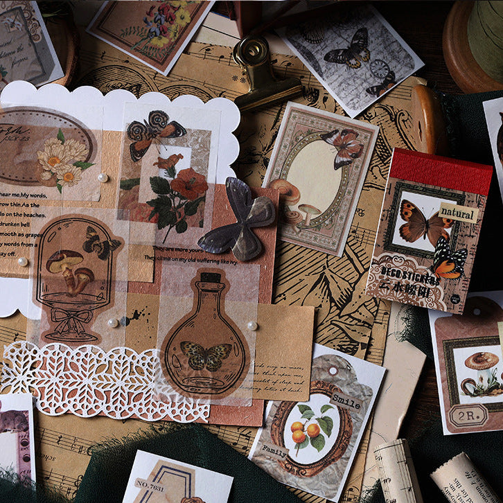 Red Bean Memory vintage washi sticker book with earthy red botanical illustrations arranged on kraft paper with vintage stamp and lace decor