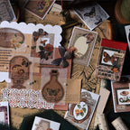 Red Bean Memory vintage washi sticker book with earthy red botanical illustrations arranged on kraft paper with vintage stamp and lace decor