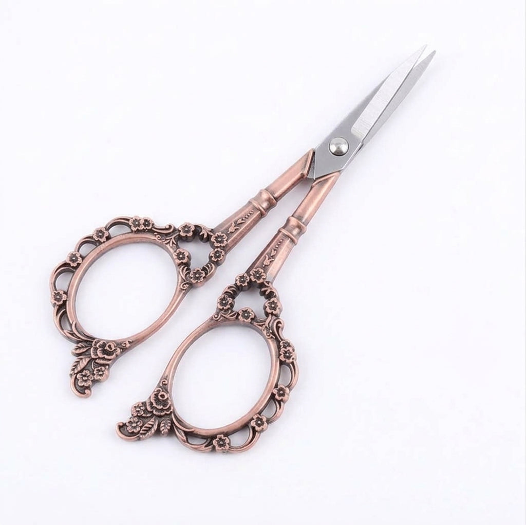 Red copper plum blossom scissors with ornate flower handle
