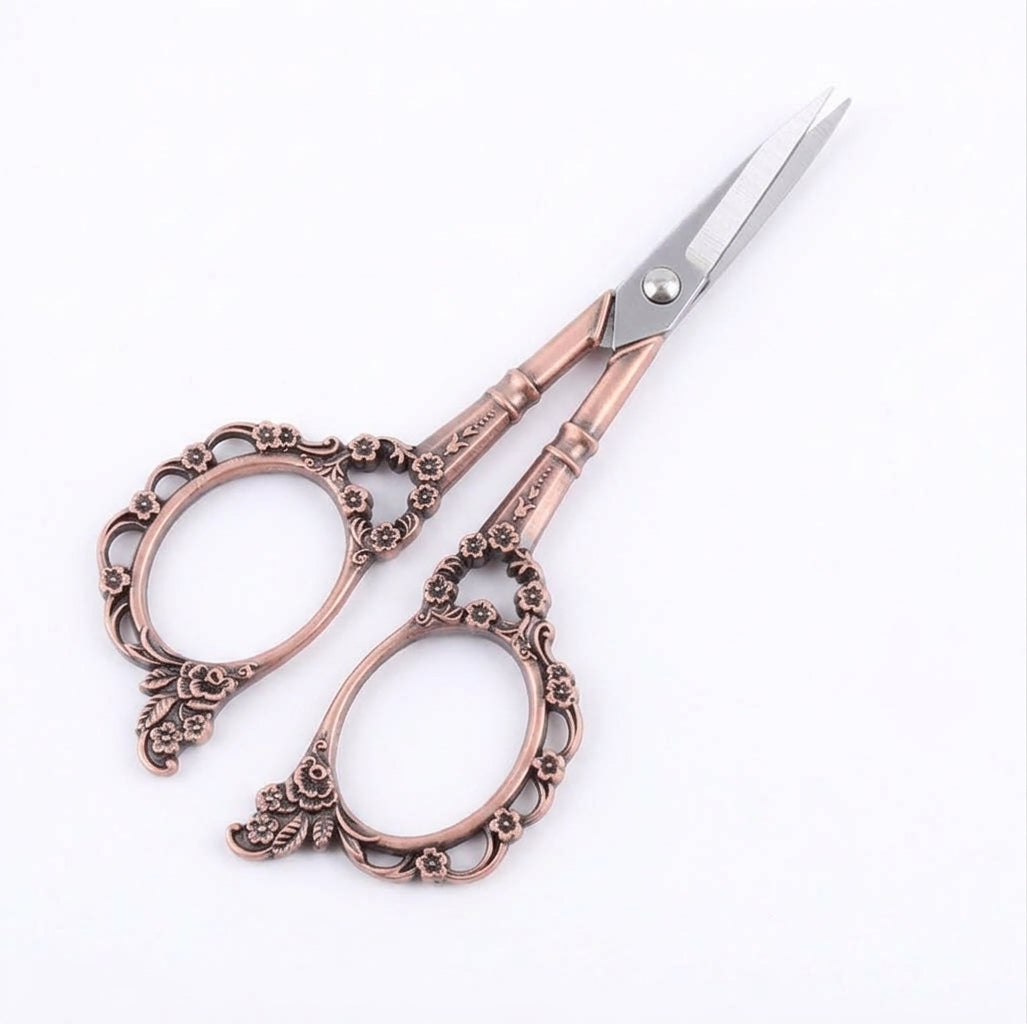 Red copper plum blossom scissors with ornate flower handle