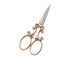 Vintage scroll scissors with ornate vine handles in red copper finish