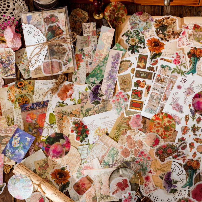 Top view of scattered vintage sticker sheets and ephemera