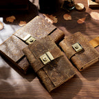Two carved leather lock journals A6 stacked on rustic wood