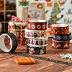 Stacked Christmas washi tape rolls with decorative strips and ornaments