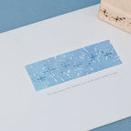 Star trail transparent impression on blue background with scattered stardust and celestial border design, carved rubber constellation stamp print for scrapbook layering