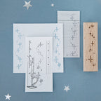 Starlight sonata beech wood stamp with carved rubber constellation impression on blue background, printed card showing star trail design for planner decoration