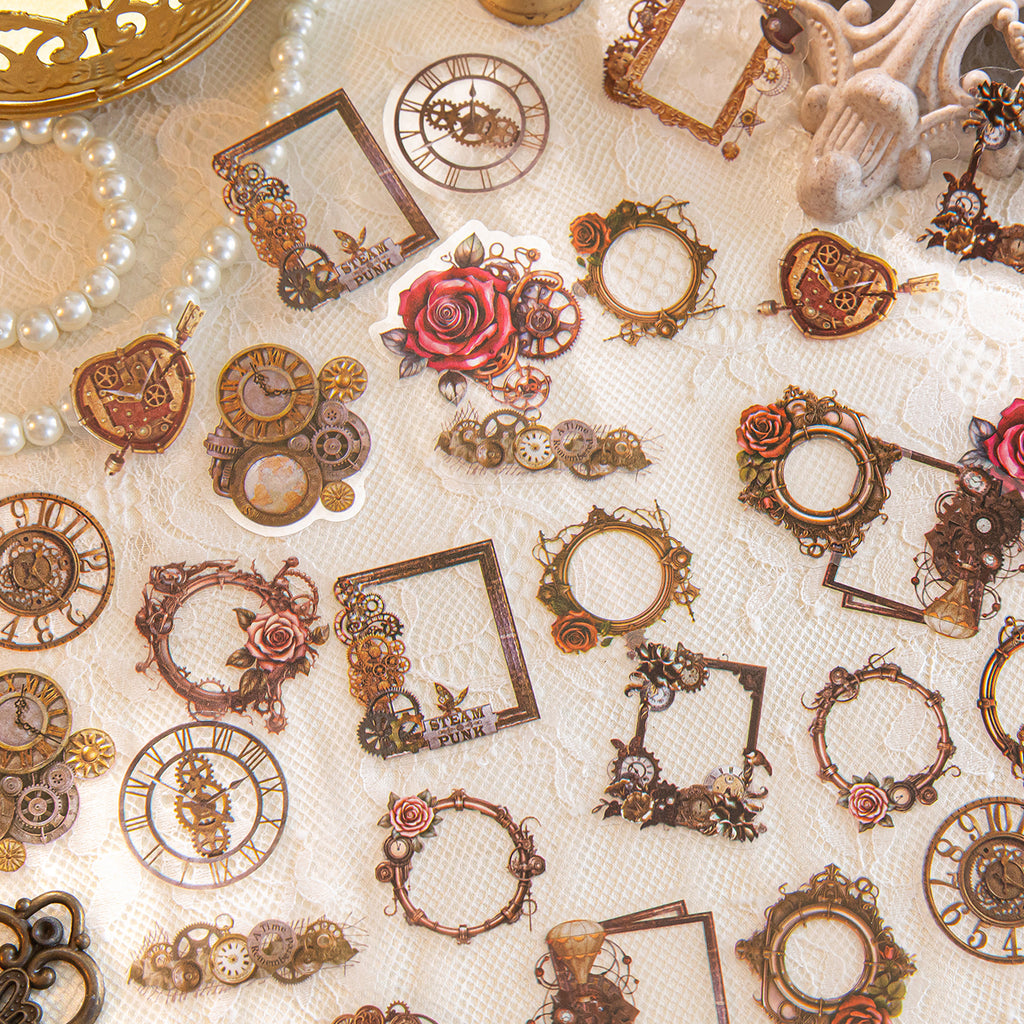 Vintage steampunk PET stickers with brass gears, clock faces, rose frames, and heart locks scattered on white lace fabric.
