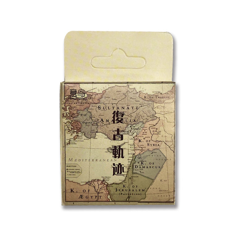Vintage style cartography and railway track stickers in a collectible box labeled The Cartographer's Route