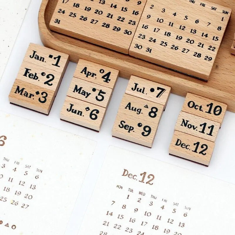 Variant image for The Complete Set (20 Pcs) vintage wooden perpetual calendar stamp set. Showcases the full collection of solid wood stamps, including months, days, and date grids, neatly arranged in a wooden storage tray for bullet journaling.