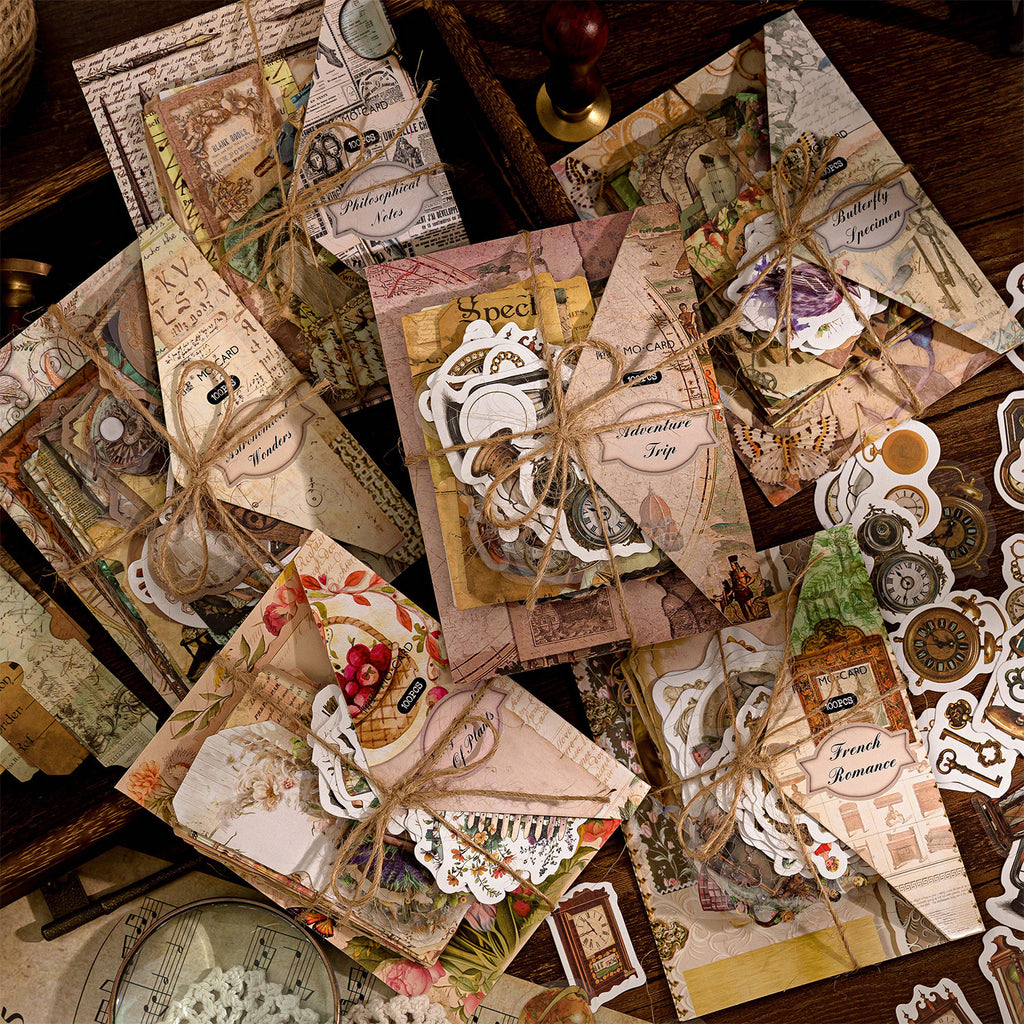 Six Time Museum sticker packs piled on a dark vintage desk