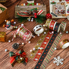 Christmas washi tape strips with trees and snowflakes on festive wooden table