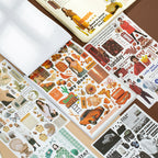 Washi paper sticker book opened displaying 50 unique vintage designs