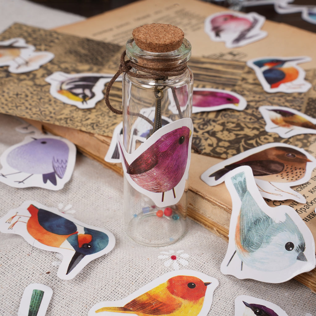 Watercolor bird sticker collection showing 46 adorable pastel bird designs in decorative gift box