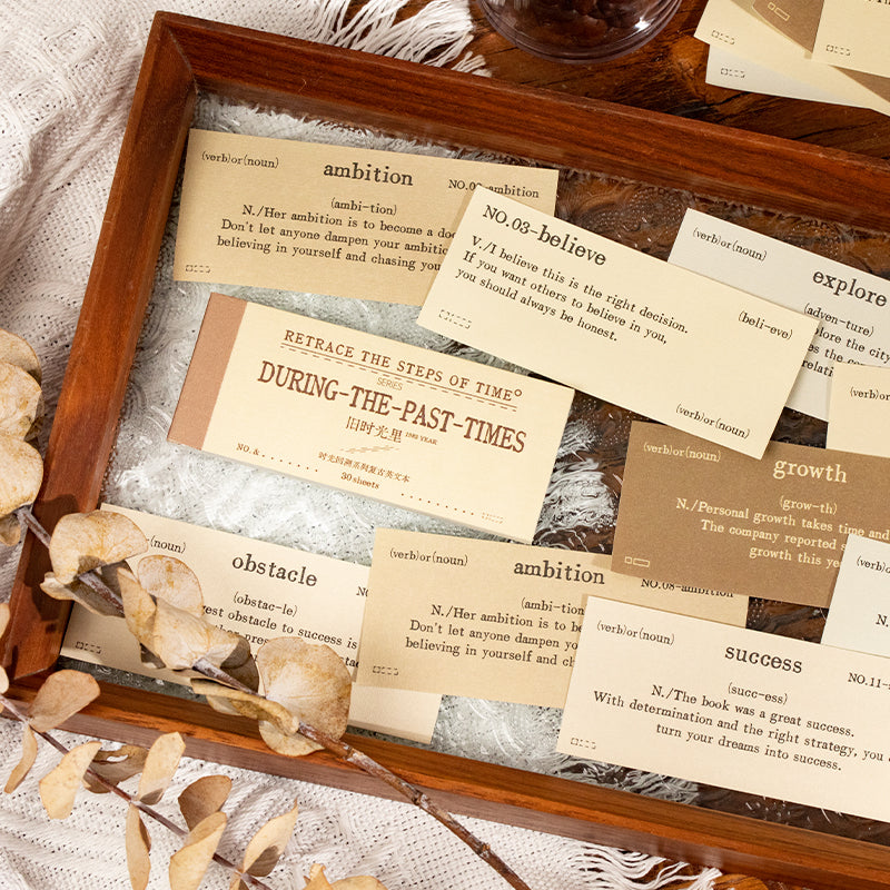 Close-up view of vintage English ephemera labels showing detailed designs and typography