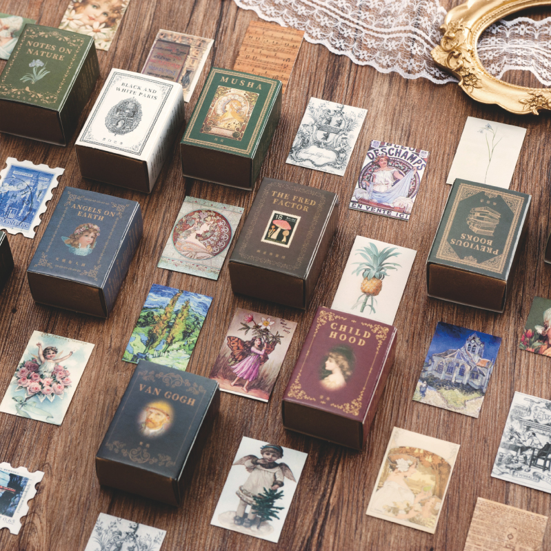 Close-up of vintage mini cards showing artistic designs and storytelling elements