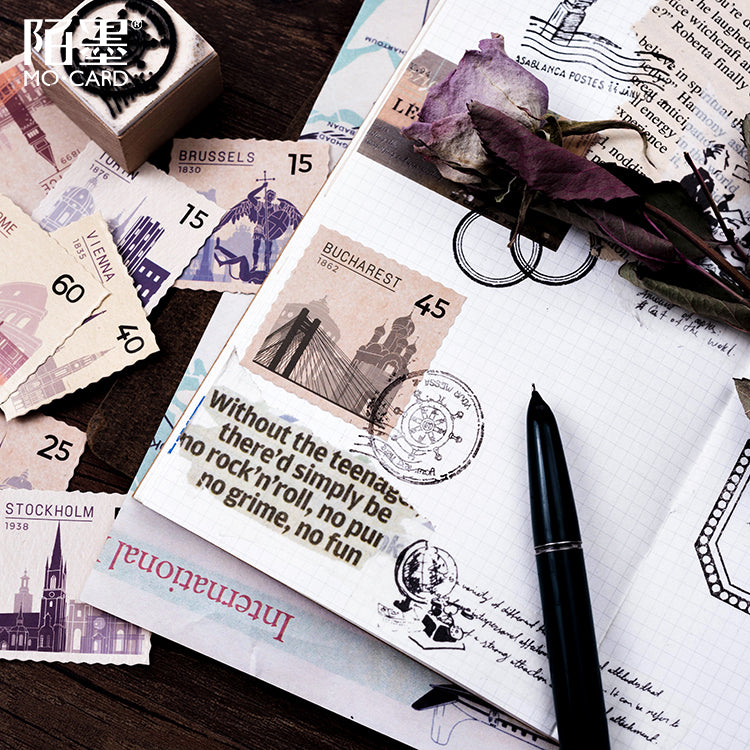 Close-up of vintage world postal stickers showing detailed stamp designs and cool colors