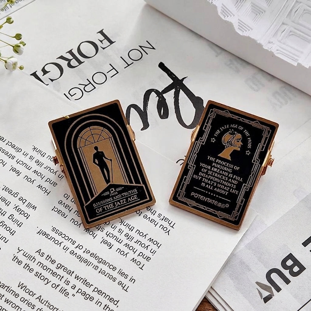 Gold embossed binder clips on open book pages