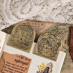 Vintage binder clips holding letters and ephemera on lace fabric