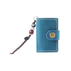 Vintage blue mini leather traveler's notebook charm on white