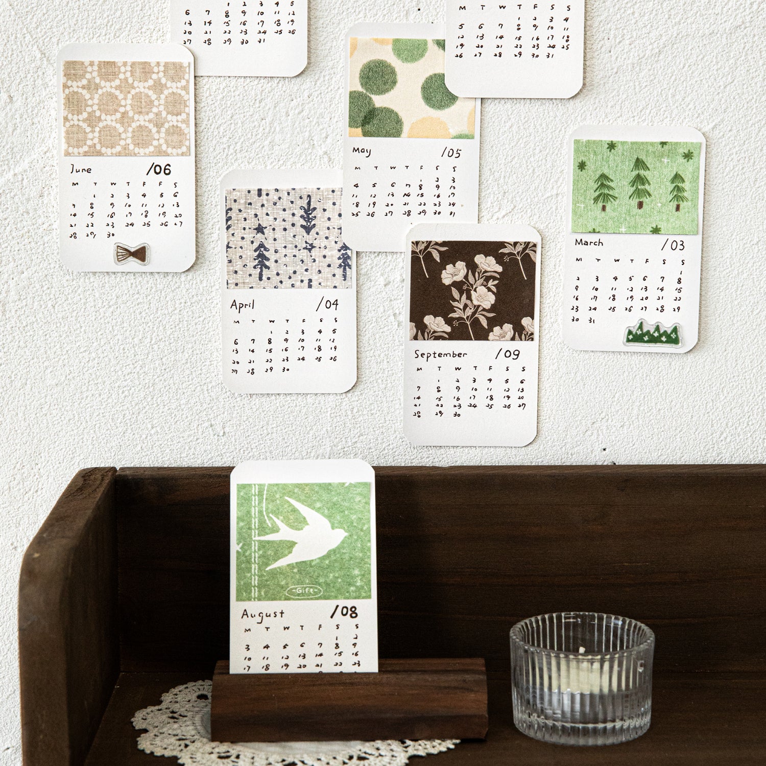 Vintage calendar themed ephemera paper sheets with month names and date grids printed, mixed lightweight paper and PET overlays for planner decoration and collage
