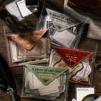 Four vintage letter sticker packs spread on dark wood desk — Yellowed Letters, The Time Postman, Notes on Love and Beauty, and Words Are Limited themes
