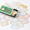 Vintage border label stickers in frame and tag shapes spread from matchbox carton
