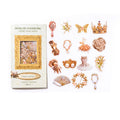 Delicate trinkets PET sticker pack with crowns, hand mirrors, fans, ballet dresses, and rose motifs displayed beside gilded packaging.