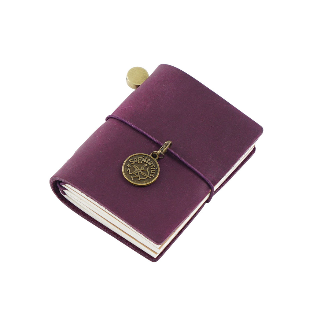 Vintage plum purple crazy horse leather pocket journal with metallic charm for aesthetic junk journaling
