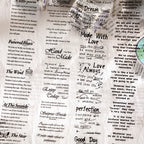 Collage of vintage script PET tape pieces with assorted English phrases, poems, and motivational quotes on aged paper.