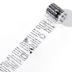 Unrolled vintage script PET tape strip with romantic phrases, butterfly and heart illustrations in purple-tinted black ink on transparent backing.
