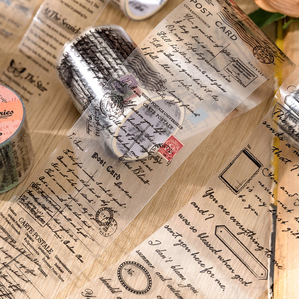 Unrolled vintage script PET tape strips with handwritten English paragraphs and decorative text laid flat for display.