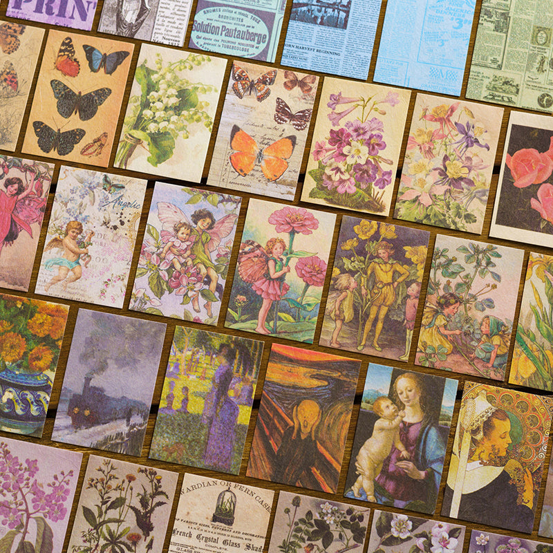 Flat lay of vintage ephemera paper sheets showing butterflies, flower fairies, Renaissance paintings, botanical prints and newspaper backgrounds spread on wood surface