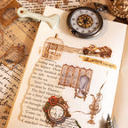 Vintage PET sticker collage on torn paper featuring a birdcage, gloved hand, folding screen, armchair, and rose frame beside a pocket watch.