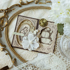 Vintage lace memo pad used in a romantic journal spread with pearls, butterflies, and a brass clock