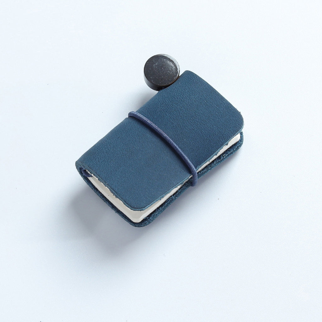 Blue waxed leather mini traveler's notebook charm with elastic band and vintage metal clasp