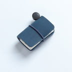 Blue waxed leather mini traveler's notebook charm with elastic band and vintage metal clasp