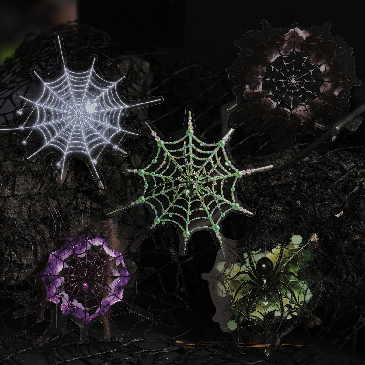Glowing spider web stickers — white, green and violet — on a dark moody background