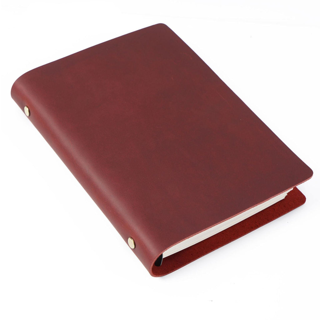 Wine red crazy horse leather A5 notebook with brass ring binder and aged leather finish.