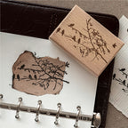 Multiple vintage wooden rubber stamps in square, round, and rectangular shapes on white background with ink bottles, carved botanical and nature designs