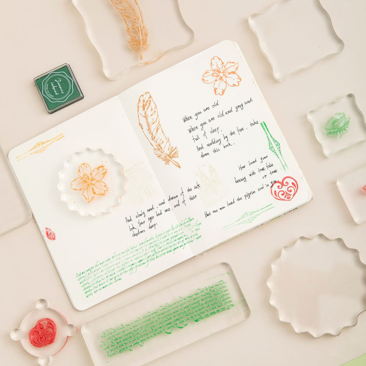 Acrylic stamp blocks used in a journal spread – clear mounting plates with stamped floral impressions on paper