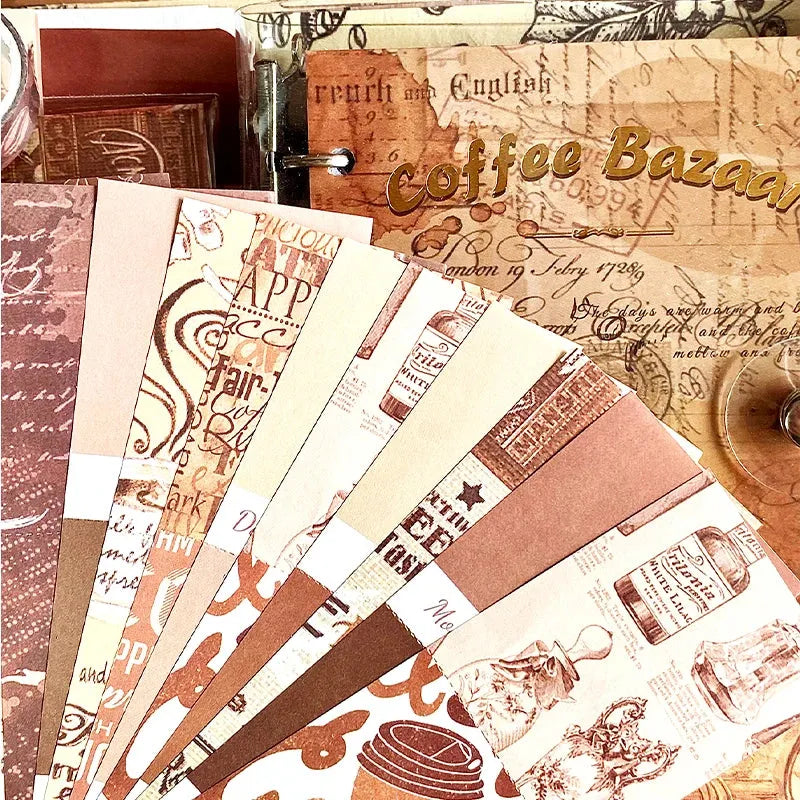 A fan display of vintage coffee-themed background material papers from the Coffee Bazaar journal kit, featuring classical script, roasted coffee tones, and retro illustrations for Dark Academia scrapbooking.