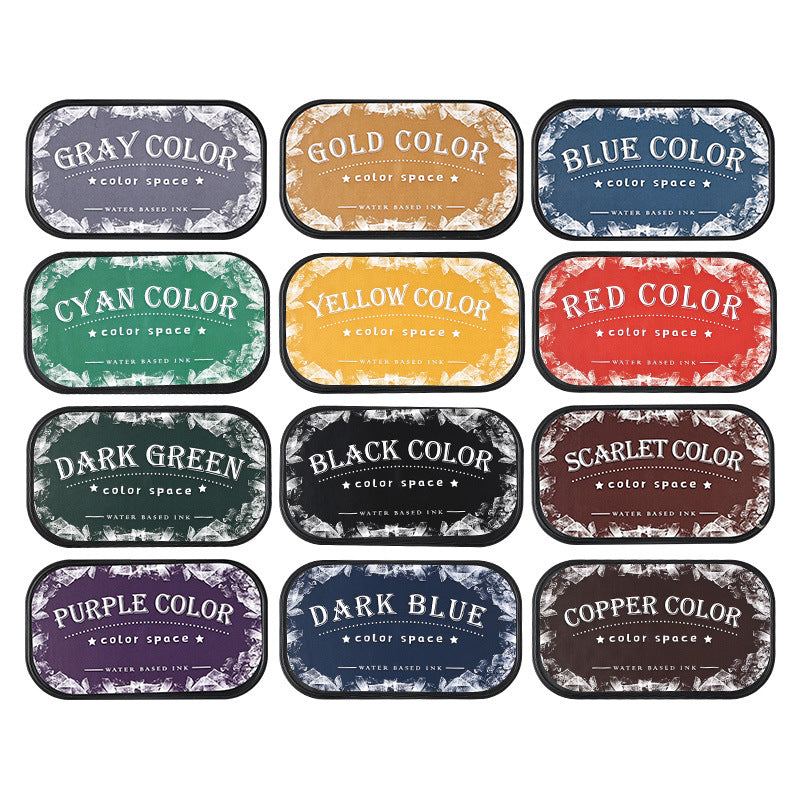 Complete set of 12 Color Space ink pads on white background