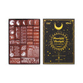 Clean studio shot of the complete Moonlight Starlight vintage wooden stamp set on a white background. Shows the luxurious black and gold-foil cover next to the 29 intricately designed celestial and postal stamps.