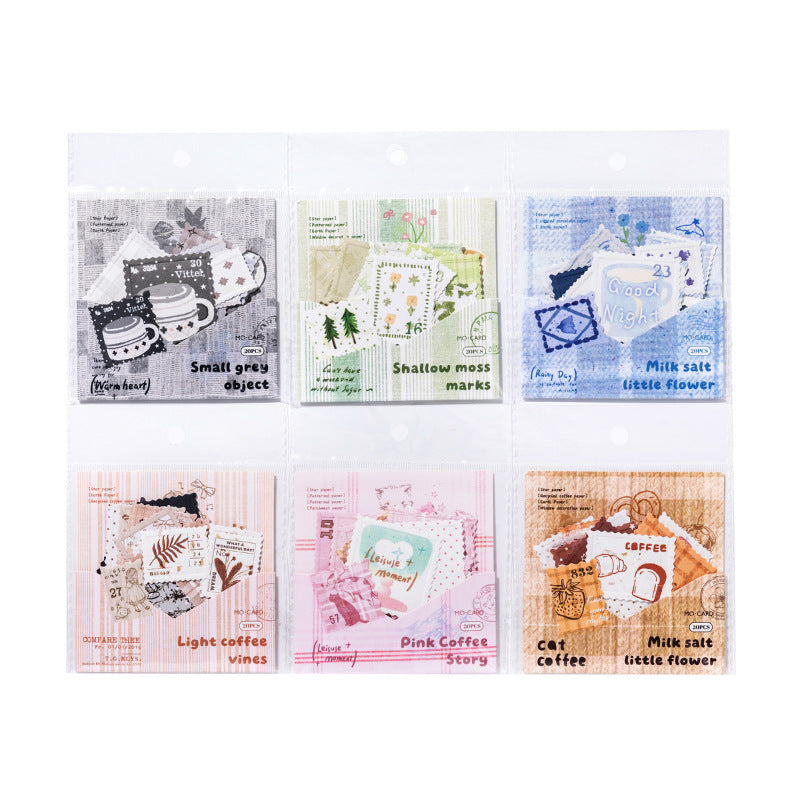 A neat 2x3 grid showing the retail packaging of all six Vintage Letterpress Faux Postage Stamp Ephemera sets in their clear protective sleeves, ready for aesthetic scrapbooking and penpal mail.