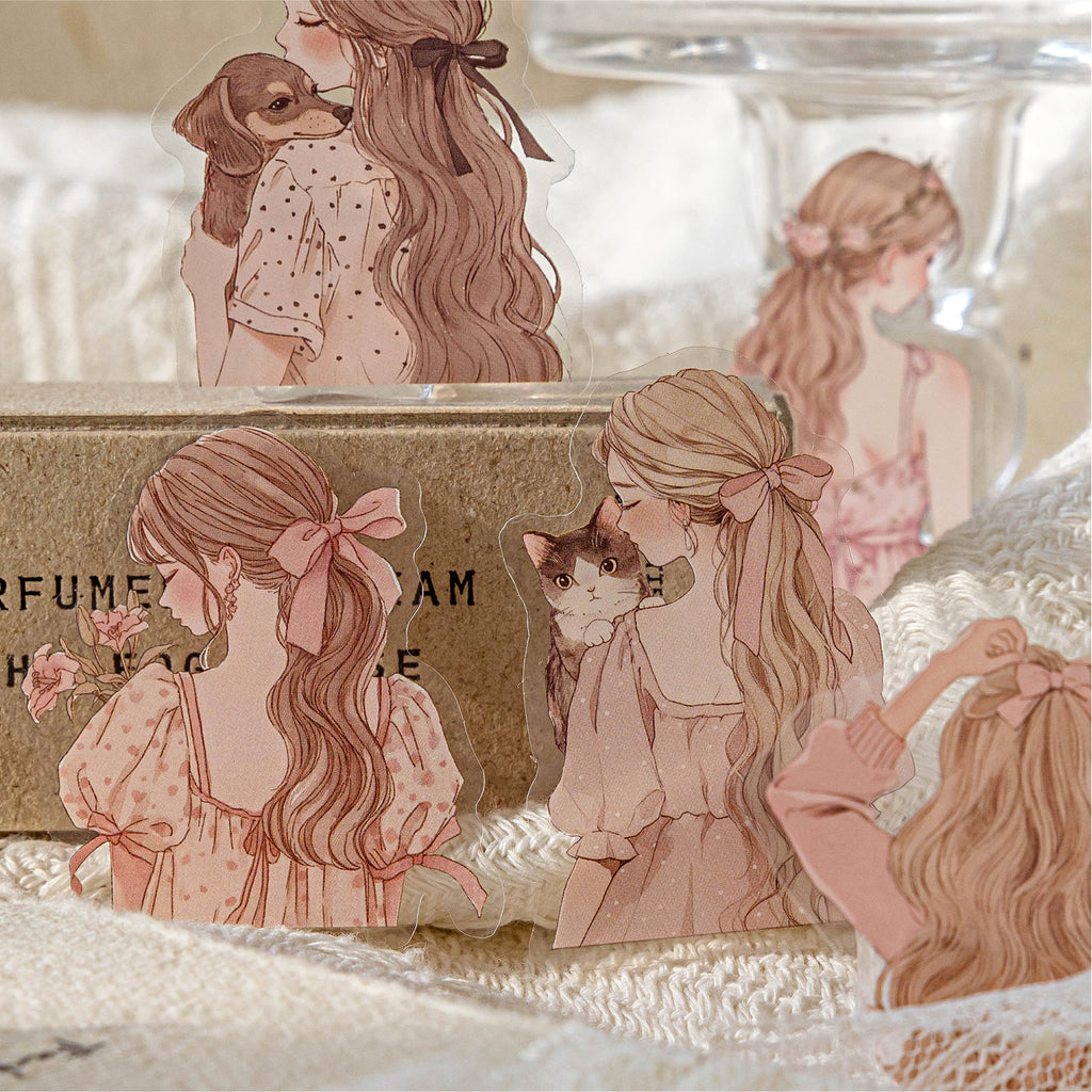 Macro shot of aesthetic girl silhouette PET stickers featuring soft pink outfits and pets. Layered against a rustic kraft box and knit blanket for cozy journaling inspiration.