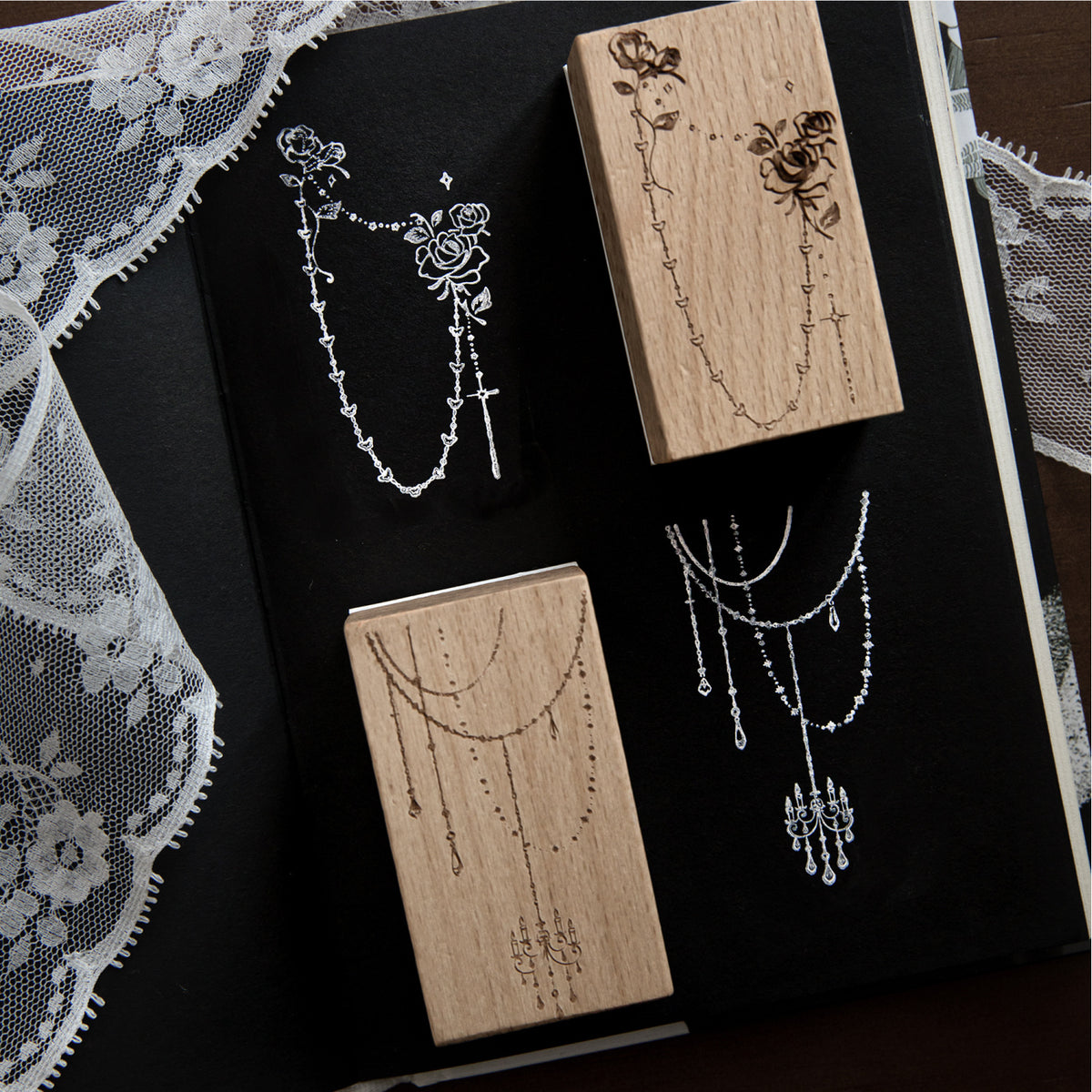 Long chain design wood stamps on black velvet – laser engraved pendant chains on beech blocks